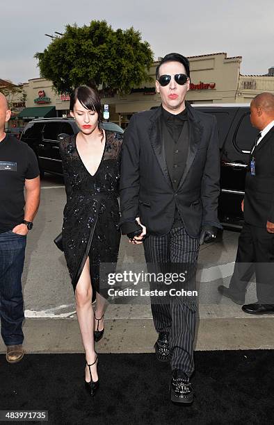 Lindsay Usich and musician Marilyn Manson attend the premiere of Warner Bros. Pictures and Alcon Entertainment's "Transcendence" at Regency Village...