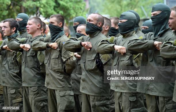 Recruits of the Azov far-right Ukrainian volunteer battalion take their oaths during a ceremony in Kiev, on August 14, 2015. Two people were killed...