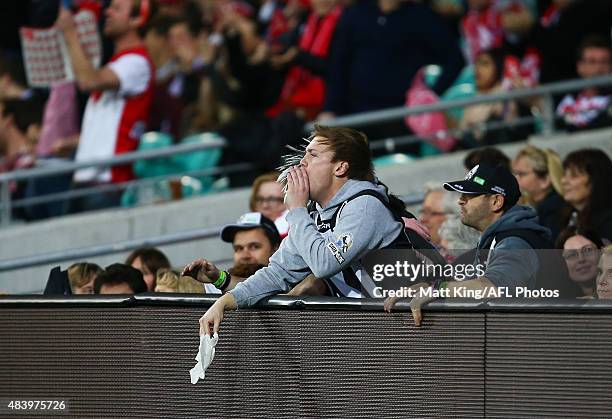 Collingwood supporter boos after Adam Goodes of the Swans marks during the round 20 AFL match between the Sydney Swans and the Collingwood Magpies at...