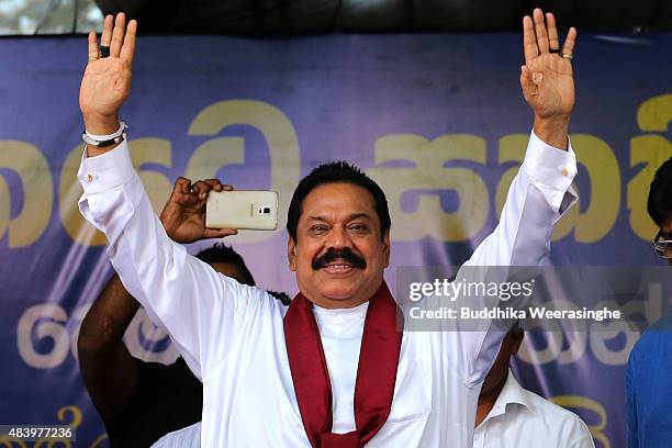 Former Sri Lankan president and parliamentary candidate Mahinda Rajapaksa waves to supporters during his party's final day of election campaign rally...