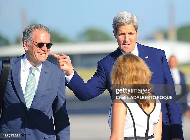 Secretary of State John Kerry gestures next to the Chief of Mission at the U.S. Embassy in Havana Jeffrey DeLaurentis upon his arrival at Jose Marti...