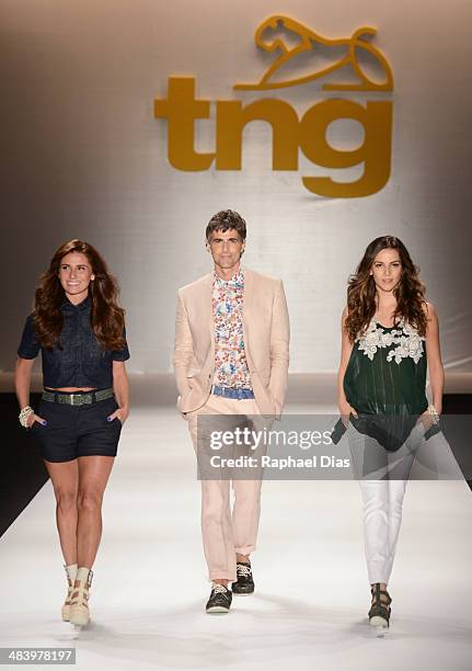 Giovanna Antonelli, Reynaldo Gianecchini and Taina Muller walk the runway during TNG show at Fashion Rio Summer 2014/2015 at Marina da Gloria on...