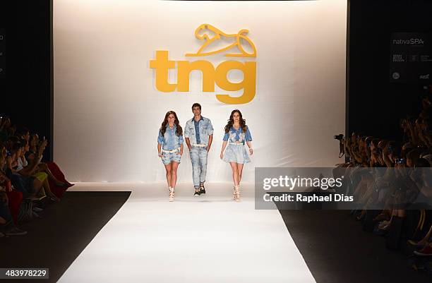 Giovanna Antonelli, Reynaldo Gianecchini and Taina Muller walk the runway during TNG show at Fashion Rio Summer 2014/2015 at Marina da Gloria on...