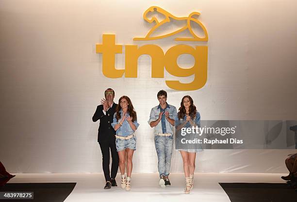 The stylist, Giovanna Antonelli, Reynaldo Gianecchini and Taina Muller walk the runway during TNG show at Fashion Rio Summer 2014/2015 at Marina da...