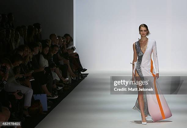 Model walks the runway wearing designs by Yousef Akbar at the Innovators show at Mercedes-Benz Fashion Week Australia 2014 on April 10, 2014 in...