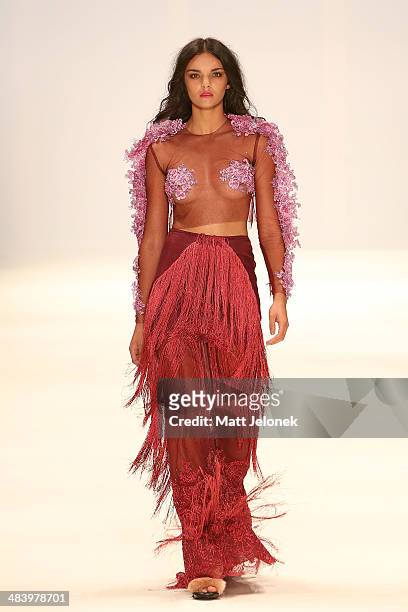 Model walks the runway wearing designs by Dyspnea at the New Generation show at Mercedes-Benz Fashion Week Australia 2014 at on April 10, 2014 in...