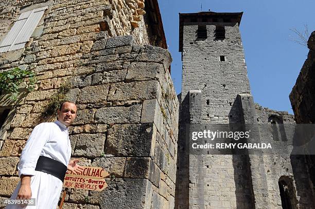 Father Guillaume Soury-Lavergne poses on August 12, 2015 outside the Benedictine abbey of Marcilhac-sur-Cele, in the Lot gorges, southern France....