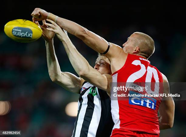 Ben Reid of the Magpies and Sam Reid of the Swans compete during the round 20 AFL match between the Sydney Swans and the Collingwood Magpies at SCG...