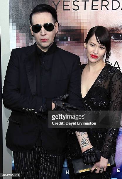 Recording artist Marilyn Manson and Lindsay Usich attend the premiere of Warner Bros. Pictures and Alcon Entertainment's "Transcendence" at the...