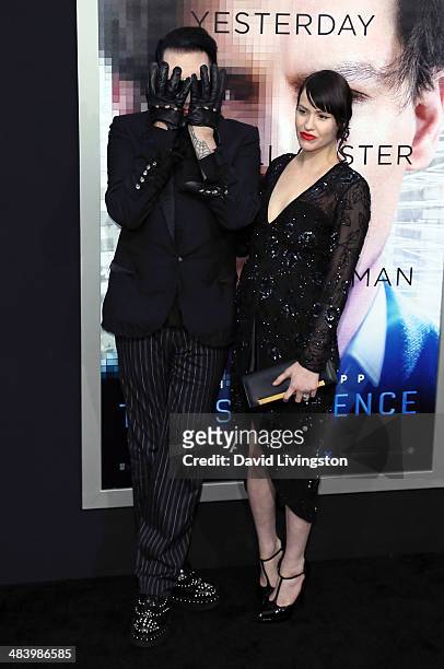 Recording artist Marilyn Manson and Lindsay Usich attend the premiere of Warner Bros. Pictures and Alcon Entertainment's "Transcendence" at the...