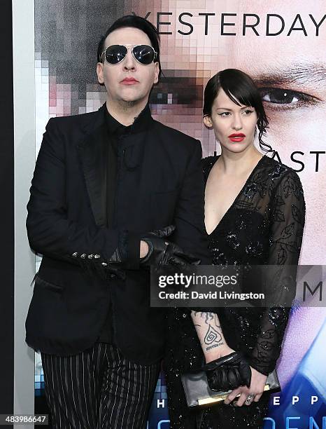 Recording artist Marilyn Manson and Lindsay Usich attend the premiere of Warner Bros. Pictures and Alcon Entertainment's "Transcendence" at the...