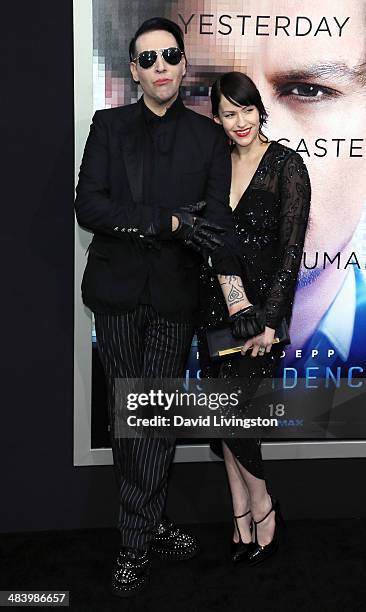 Recording artist Marilyn Manson and Lindsay Usich attend the premiere of Warner Bros. Pictures and Alcon Entertainment's "Transcendence" at the...