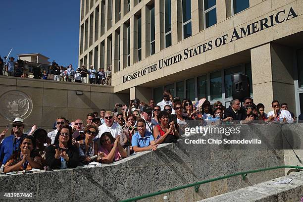 Employees and guests of the newly reopened U.S. Embassy attend the flag-raising ceremony August 14, 2015 in Havana, Cuba. Secretary of State John...