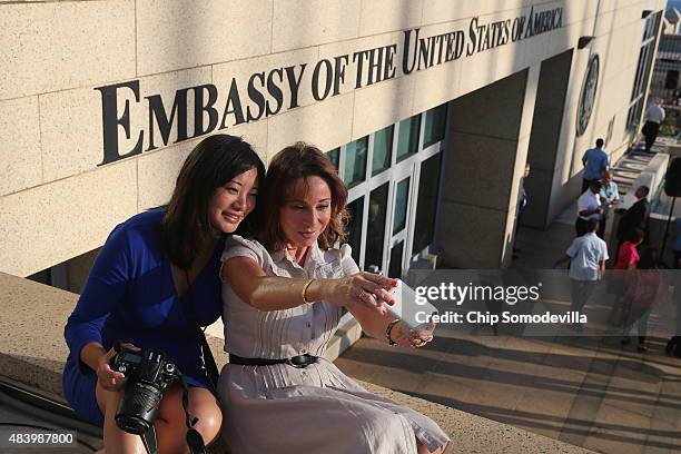 Journalists shoot 'selfies' from the rooftop of the newly reopened U.S. Embassy ahead of the flag-raising ceremony August 14, 2015 in Havana, Cuba....