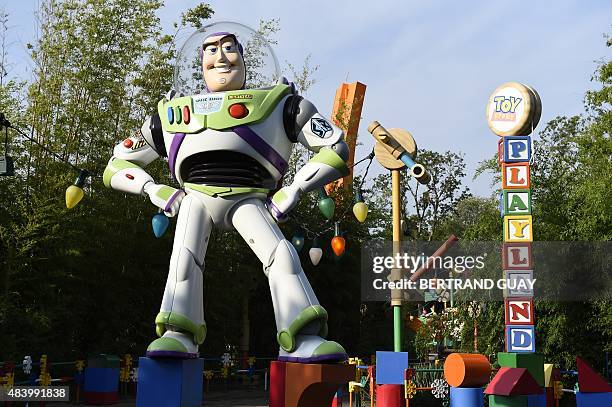 Photo taken on August 13, 2015 shows a Buzz Lightyear statue at Toy Story Playland at the Walt Disney Studios park in Disneyland Paris in...