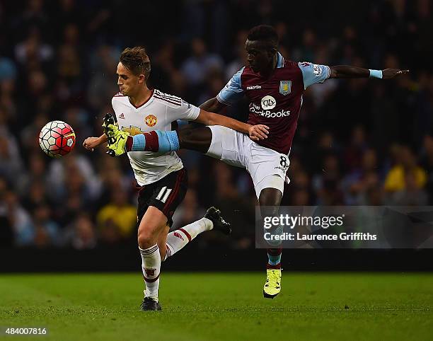 Idrissa Gueye of Aston Villa challenges Adnan Januzaj of Manchester United for the ball during the Barclays Premier League match between Aston Villa...