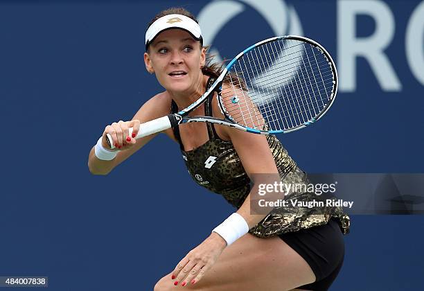 Agnieszka Radwanska of Poland plays a shot against Simona Halep of Romania during Day 5 of the Rogers Cup at the Aviva Centre on August 14, 2015 in...