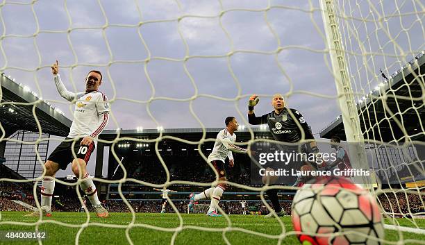 Wayne Rooney of Manchester United celebrates after Adnan Januzaj of Manchester United scored the opening goal past Brad Guzan of Aston Villa during...