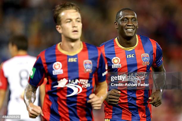 Emile Heskey of the Jets celebrates a goal with teammate Adam Taggart in the foreground during the round 27 A-League match between the Newcastle Jets...