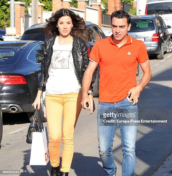Barcelona football player Xavi Hernandez and Nuria Cunillera attend Lia Fabregas's first birthday party on April 10, 2014 in Barcelona, Spain.