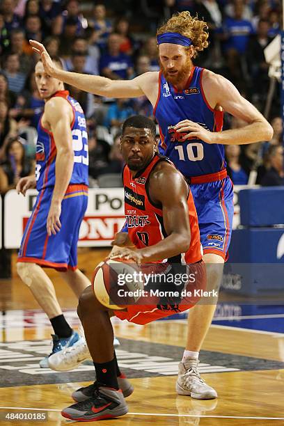 Luke Schenscher of the 36ers blocks the path of Jermaine Beal of the Wildcats during game two of the NBL Grand Final series between the Adelaide...