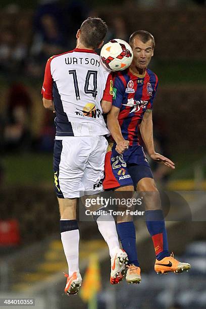 Joel Griffiths of the Jets contests a header with Cameron Watson of Adelaide during the round 27 A-League match between the Newcastle Jets and...