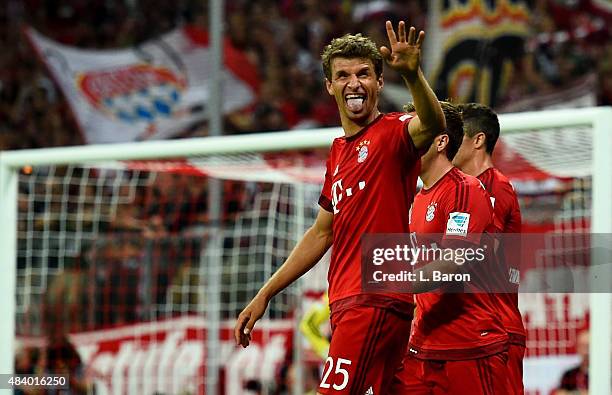 Thomas Mueller of Muenchen celebrates after scoring his teams third goal during the Bundesliga match between FC Bayern Muenchen and Hamburger SV at...