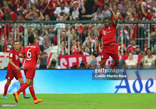 Douglas Costa of Bayern Munich celebrates as he scores their fifth goal during the Bundesliga match between FC Bayern Muenchen and Hamburger SV at...