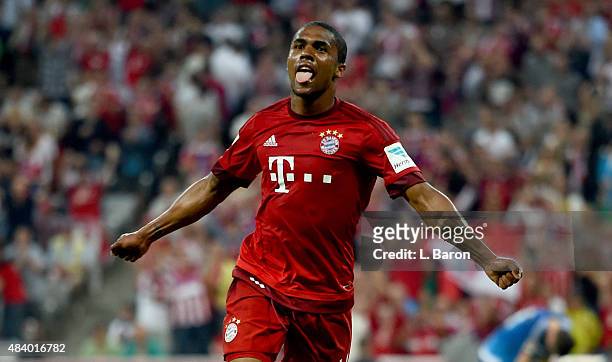 Douglas Costa of Muenchen celebrates after scoring his teams last goal during the Bundesliga match between FC Bayern Muenchen and Hamburger SV at...