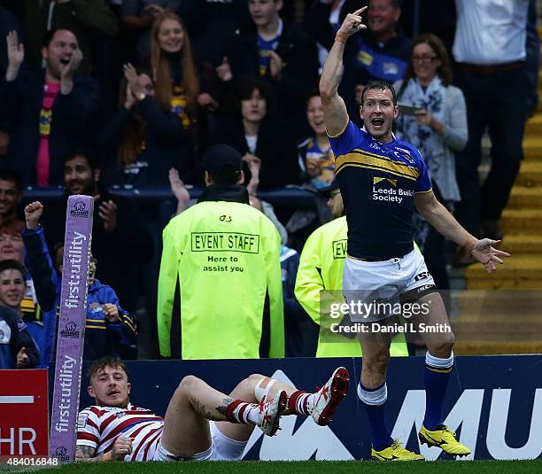 Danny McGuire of Leeds Rhinos celebrates after touching the try line during the Round 2 match of the First Utility Super League Super 8s between...