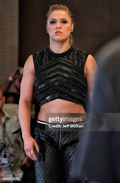 Women's bantamweight champion Ronda Rousey prepares to face off with opponent Bethe Correira of Brazil for the media during the UFC 190 Ultimate...