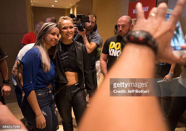 Women's bantamweight champion Ronda Rousey poses with fans during the UFC 190 Ultimate Media Day at the Sheraton Rio Hotel on July 30, 2015 in Rio de...
