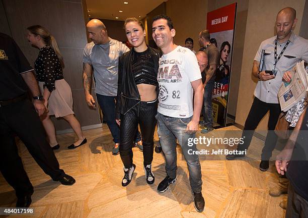 Women's bantamweight champion Ronda Rousey poses with fans during the UFC 190 Ultimate Media Day at the Sheraton Rio Hotel on July 30, 2015 in Rio de...