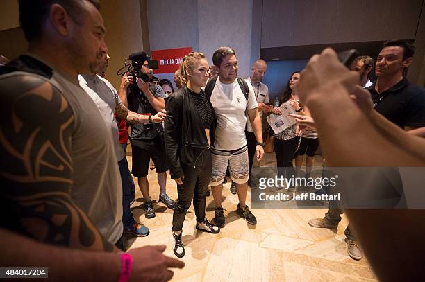 Women's bantamweight champion Ronda Rousey poses with fans during the UFC 190 Ultimate Media Day at the Sheraton Rio Hotel on July 30, 2015 in Rio de...