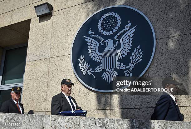 Former US Marines Jim Tracy , Larry C. Morris and Mike East arrive at the US Embassy building to take part in the reopening ceremony in Havana on...