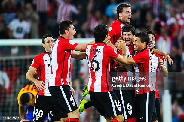 Mikel San Jose of Athletic Club celebrates with his team mates after scoring the opening goalduring the Spanish Super Cup first leg match between FC...