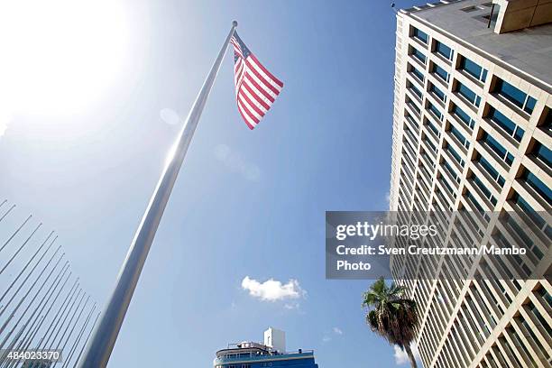 The U.S. Flag flies at the U.S. Embassy in Cuba, facing flag poles of the tribuna Antiimperialista after the flag-raising ceremony led by U.S....