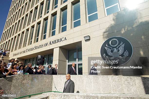 Secretary of State walks under the seal of the USA as he arrives for the flag-raising ceremony, at the U.S. Embassy in Cuba on August 14 in Havana,...