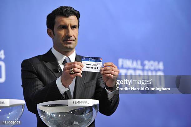 Ambassador for the final Luis Figo draws winners of semi-final 1 during the UEFA Champions League 2013/14 season final draw at the UEFA headquarters,...