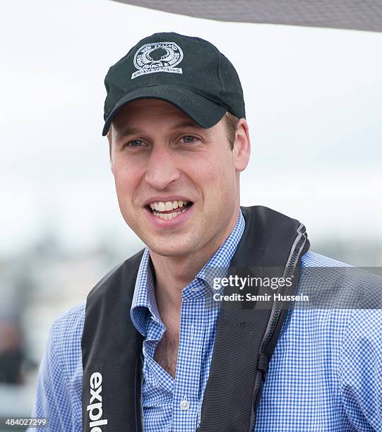 Prince William, Duke of Cambridge looks on from the New Zealand's Americas Cup Team yacht during their visit to Auckland Harbour on April 11, 2014 in...