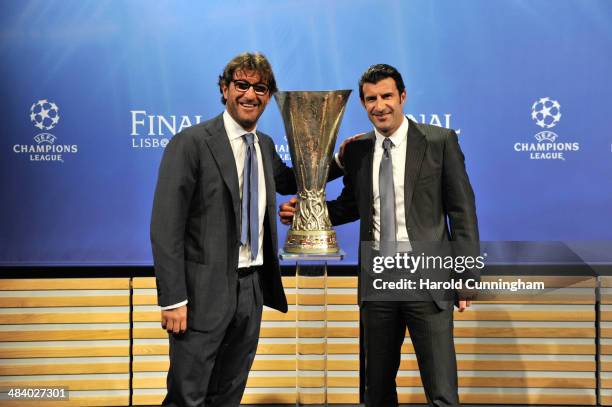 Ambassador for the Europa League final Ciro Ferrara and Ambassador for the Champions League final Luis Figo pose with Europa League trophy during the...