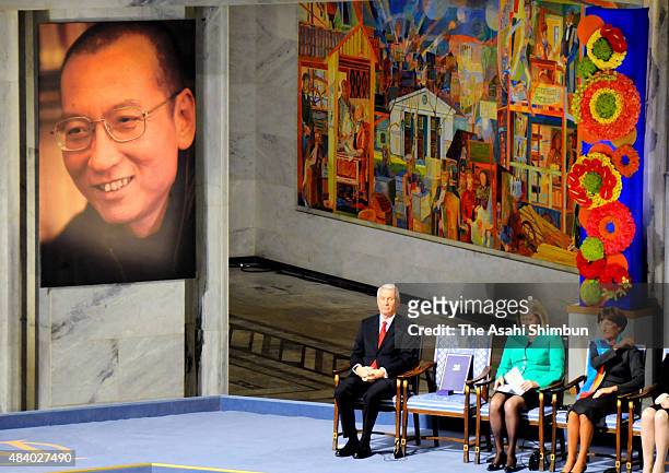 The portrait of Chinese activist Liu Xiaobo is displayed while the Nobel Peace Prize medal and certificate are place on the empty chair during the...