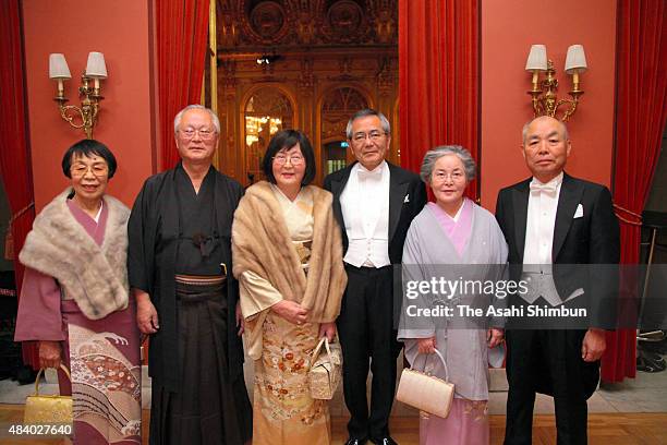 Nobel Prize in Chemistry laureate Eiichi Negishi and his wife Sumire pose with their family members at the hotel ahead of the Nobel Prize Award...