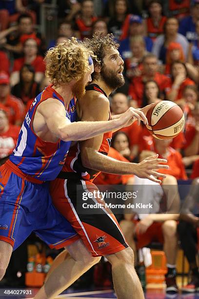 Luke Schenscher of the 36ers competes with Matt Knight of the Wildcats during game two of the NBL Grand Final series between the Adelaide 36ers and...