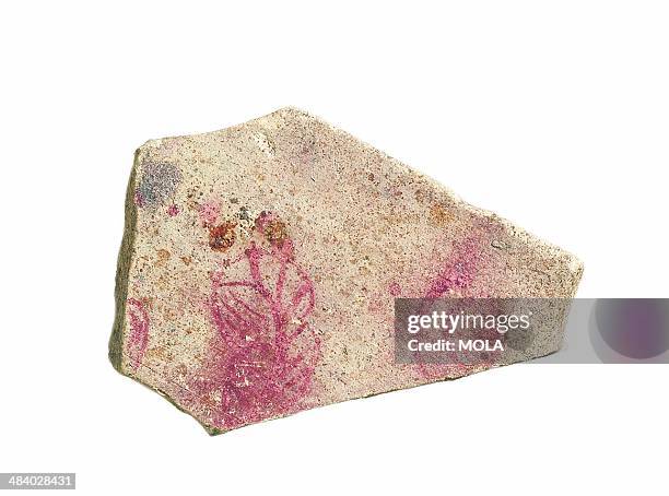 Flowers or leaves painted in red on the top of an unglazed biscuit-fired tile, probably a trial piece, from the 1988 excavation at 19 Albert...