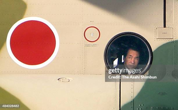 Japanese Prime Minister Naoto Kan is seen on a self-defense force helicopter during his visit to Okinawa on December 18, 2010 in Naha, Okinawa, Japan.