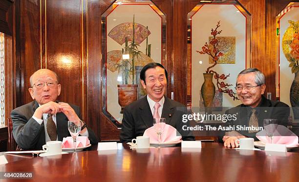 Japanese education minister Yoshiaki Takagi talks with Nobel Prize in Chemistry laureates Akira Suzuki and Eiichi Negishi a day after the award...