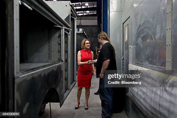 Carly Fiorina, former chairman and chief executive officer of Hewlett-Packard Co. And 2016 Republican presidential candidate, shakes hands with an...