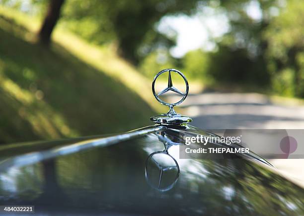 emblem logo on a mercedes -benz black torpedo 1935 - mercedes benz stock pictures, royalty-free photos & images