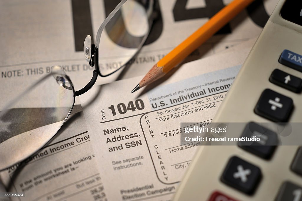 Filing taxes on IRS Form 1040 close-up view